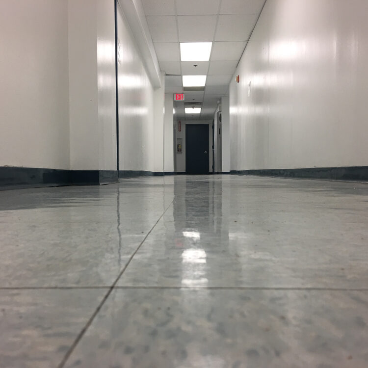Hallway,In,Office,Building.,White,Walls,And,Vinyl,Tile,Flooring